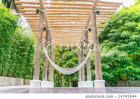 White hammocks in Luxury swimming pool . 24745844
