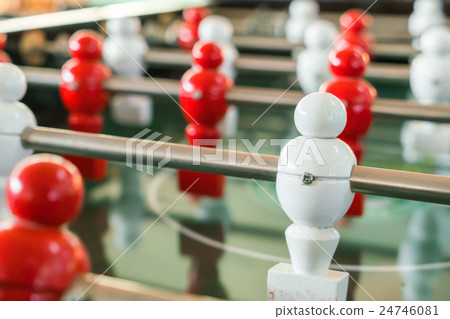 Football table game with red and white player . 24746081