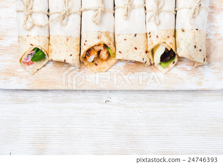 Tortilla wraps with various fillings on shabby Tortilla wraps with various fillings on shabby 24746393
