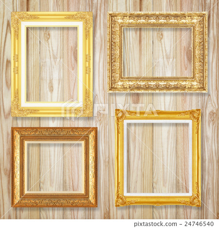 The antique gold frame on wooden wall background The antique gold frame on wooden wall background 24746540
