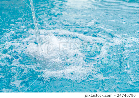 Blue swimming pool rippled water . Blue swimming pool rippled water . 24746796