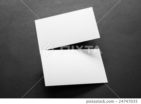 Business cards on black background . 24747035