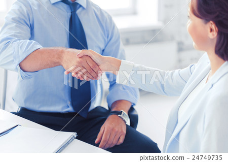 business people shaking hands in office 24749735