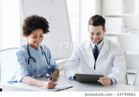 two happy doctors meeting at hospital office 24749862