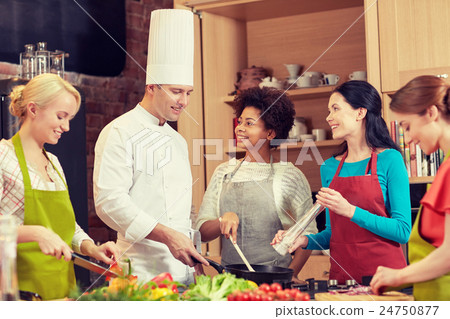 happy women and chef cook cooking in kitchen happy women and chef cook cooking in kitchen 24750877