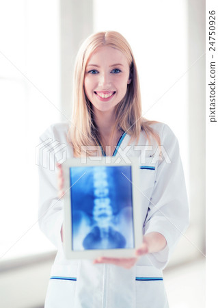 female doctor with x-ray on tablet pc 24750926
