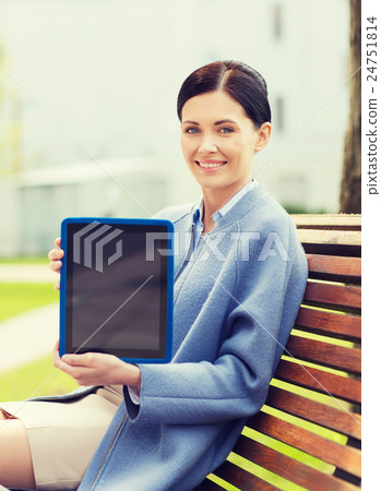 smiling business woman with tablet pc in city smiling business woman with tablet pc in city 24751814