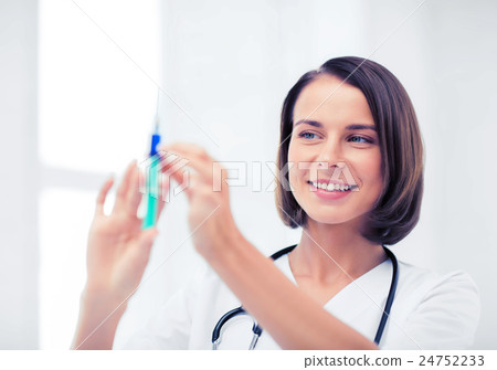 female doctor holding syringe with injection female doctor holding syringe with injection 24752233