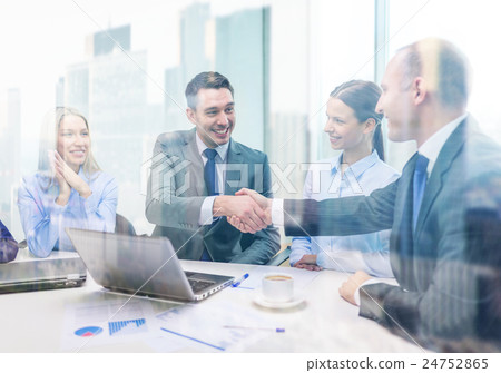 two businessman shaking hands in office 24752865