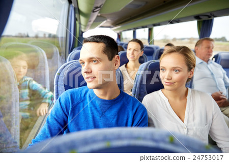 happy couple or passengers in travel bus 24753017