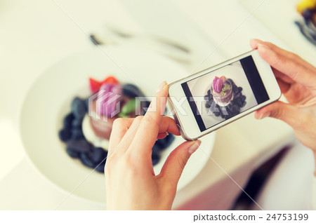 close up of woman picturing food by smartphone close up of woman picturing food by smartphone 24753199