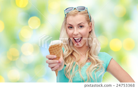 happy young woman in sunglasses eating ice cream happy young woman in sunglasses eating ice cream 24753368