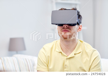 young man in virtual reality headset or 3d glasses 24754028