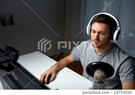 man in headset playing computer video game at home man in headset playing computer video game at home 24754090