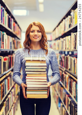 happy student girl or woman with books in library happy student girl or woman with books in library 24754203