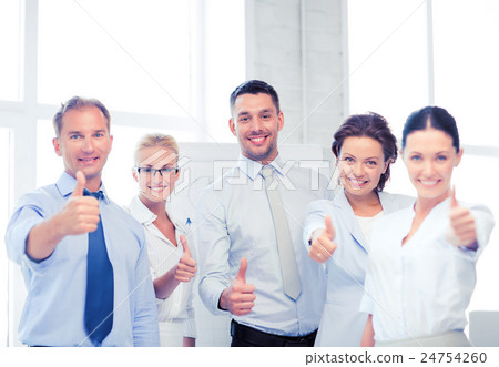 business team showing thumbs up in office business team showing thumbs up in office 24754260