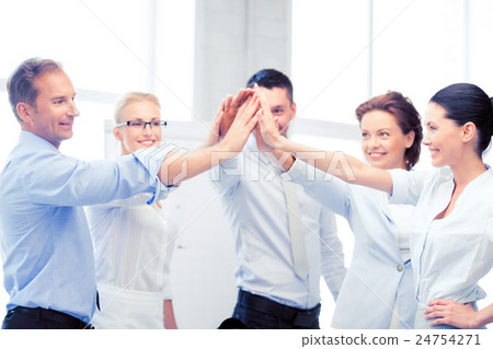 business team celebrating victory in office 24754271