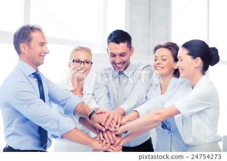 business team celebrating victory in office 24754273