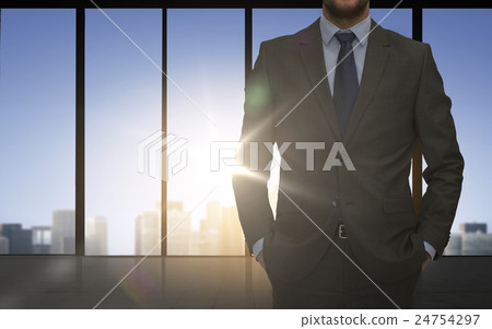 close up of business man over office background 24754297
