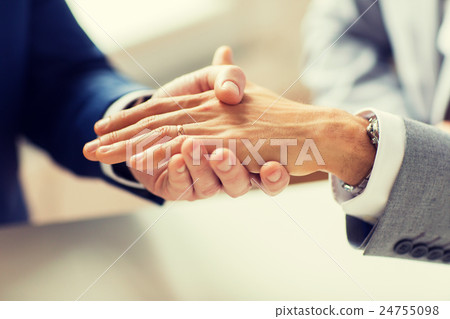 close up of male gay couple hands and wedding ring close up of male gay couple hands and wedding ring 24755098