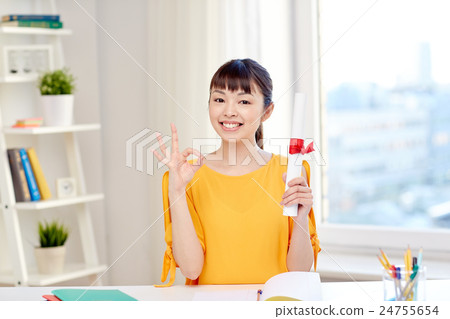 happy asian woman student with diploma at home happy asian woman student with diploma at home 24755654