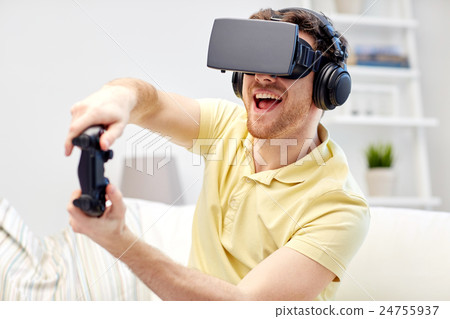 man in virtual reality headset with controller man in virtual reality headset with controller 24755937