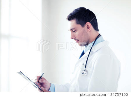 male doctor with stethoscope writing prescription 24757190