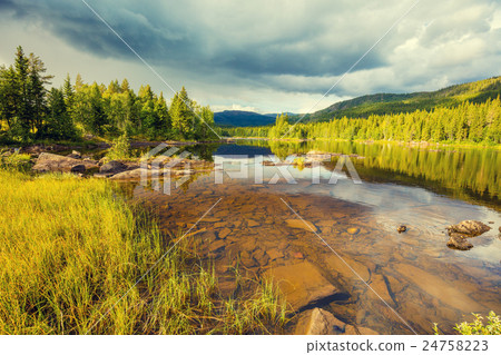 Mountain lake in autumn wit cloudy sky. Norway 24758223