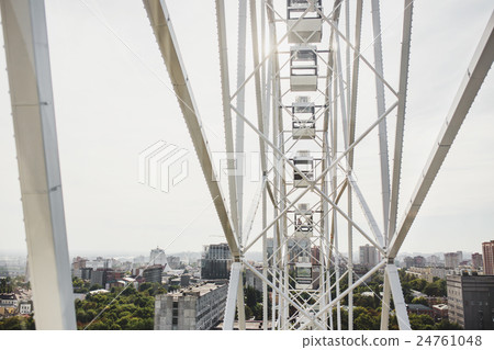 Ferris wheel on the background city and sky 24761048