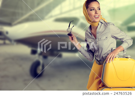 Vintage young female passenger at the airport Vintage young female passenger at the airport 24763526