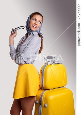 Woman preparing for travel on summer vacation Woman preparing for travel on summer vacation 24763552