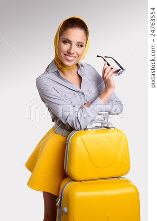 Woman preparing for travel on summer vacation Woman preparing for travel on summer vacation 24763554