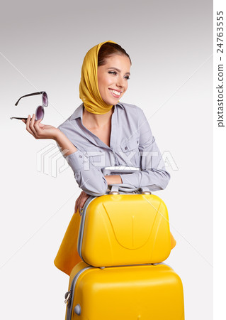 Woman preparing for travel on summer vacation Woman preparing for travel on summer vacation 24763555