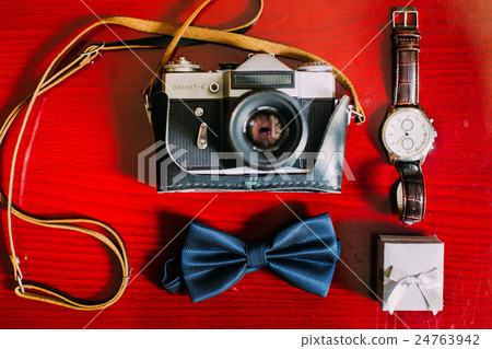 Retro camera with bow-tie, white box and watch 24763942