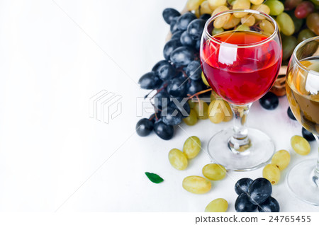 red and white wine in glasses on the table 24765455
