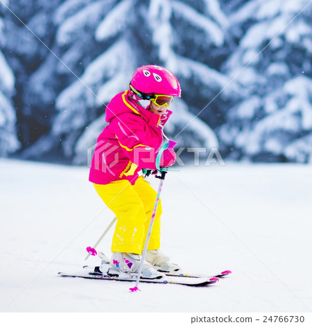 Little girl skiing in the mountains Little girl skiing in the mountains 24766730