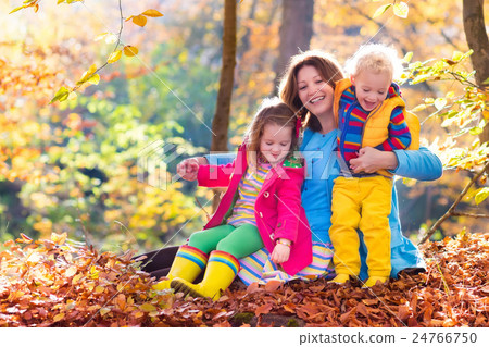 Mother and kids in autumn park Mother and kids in autumn park 24766750