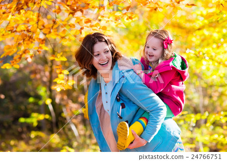 Mother and child in autumn park Mother and child in autumn park 24766751
