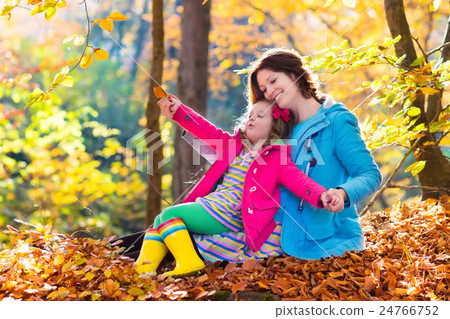 Mother and child in autumn park Mother and child in autumn park 24766752