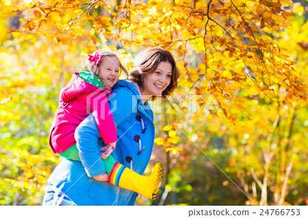 Mother and child in autumn park Mother and child in autumn park 24766753