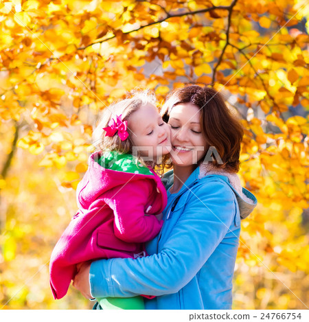 Mother and child in autumn park Mother and child in autumn park 24766754