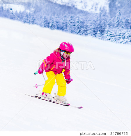 Little girl skiing in the mountains Little girl skiing in the mountains 24766755