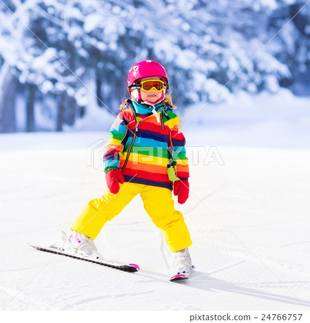 Little girl skiing in the mountains 24766757