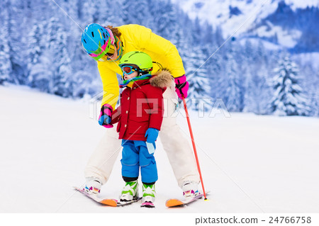 Mother and little boy learning to ski 24766758