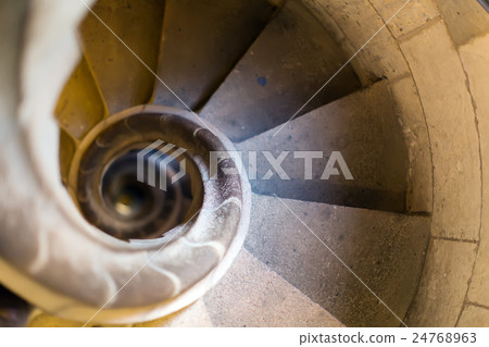 narrow stone spiral stairway 24768963