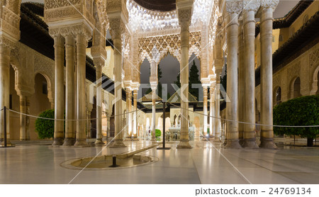 Courtyard of the Lions in night time, Alhambra. Granada, Spain Courtyard of the Lions in night time, Alhambra. Granada, Spain 24769134