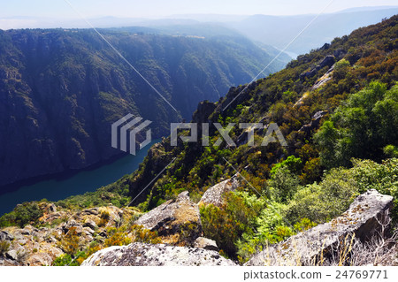 river with steep rocky banks 24769771