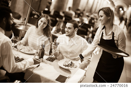 waitress bringing order at terrace table in summer day waitress bringing order at terrace table in summer day 24770016