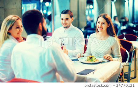 Portrait of relaxed and happy smiling adults having dinner 24770121