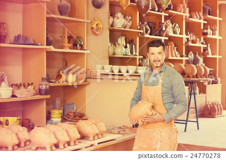 artisan having ceramics in hands 24770278